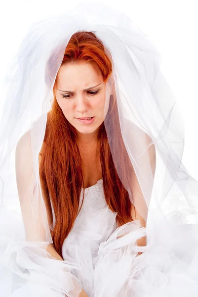 A beautiful red-haired bride cries — Stock Photo, Image