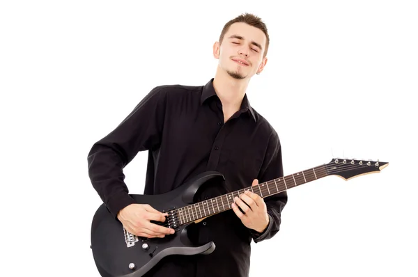 A beautiful boy with electric guitar plays — Stock Photo, Image