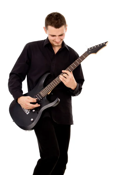 A beautiful boy with electric guitar plays — Stock Photo, Image