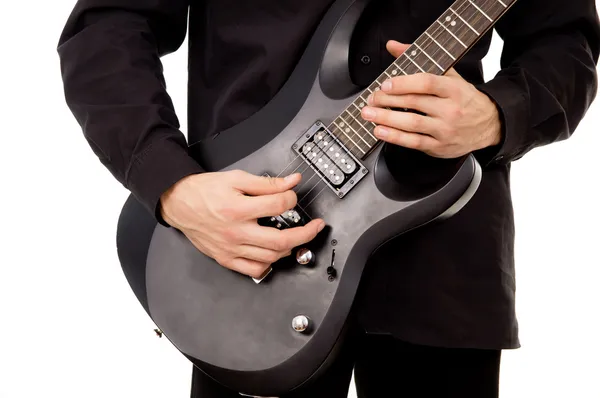 Prachtige kerel speelt de elektrische gitaar, grote-plan — Stockfoto