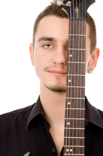 Hermoso chico piensa, presionado a la guitarra —  Fotos de Stock