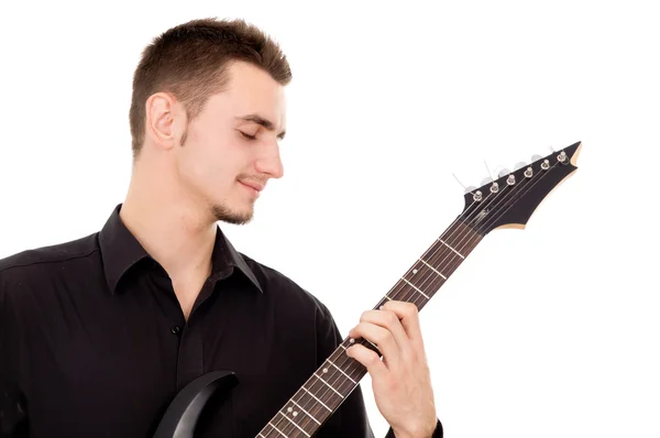 Hermoso chico, toca cuidadosamente la guitarra eléctrica — Foto de Stock