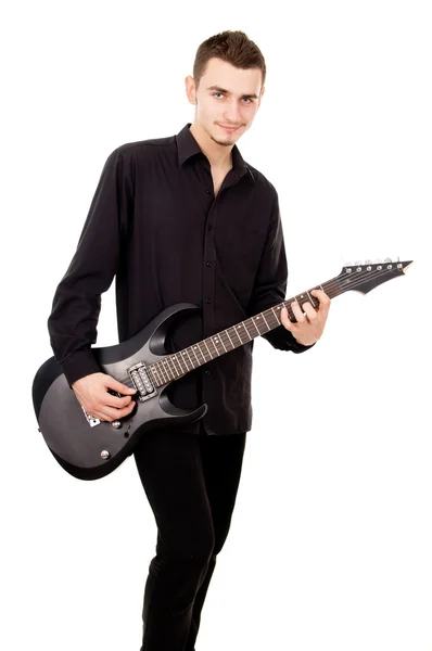 Handsome guy plays the electric guitar — Stock Photo, Image