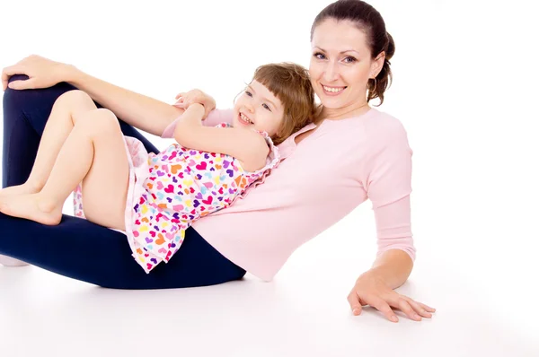 Mamá miente con el niño, se juega —  Fotos de Stock