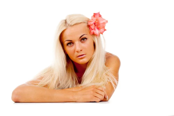 A beautiful girl with a red flower, was plaited in her hair — Stock Photo, Image