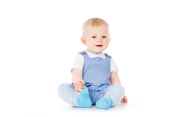 Baby sits and smiles — Stock Photo, Image