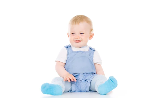 Bambino seduto guardando nella direzione — Foto Stock