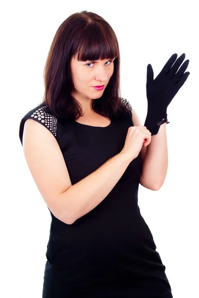 Beautiful girl poses, wears gloves — Stock Photo, Image