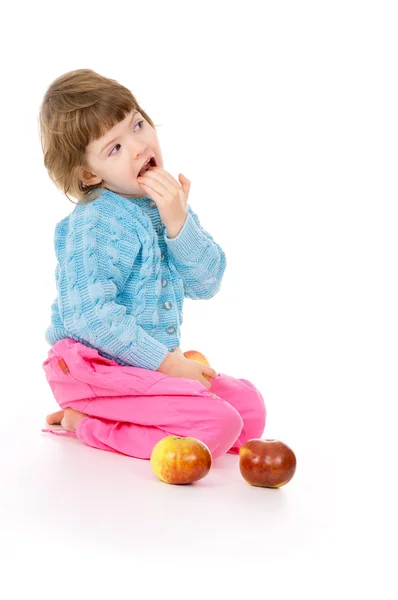 A beautiful little, girl eats apples — Stock Photo, Image