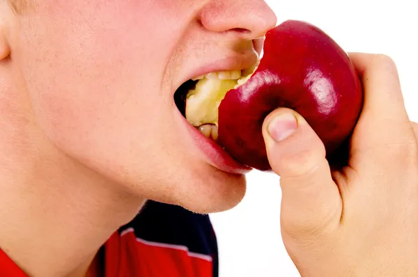 Beautiful guy, bite the Apple — Stock Photo, Image