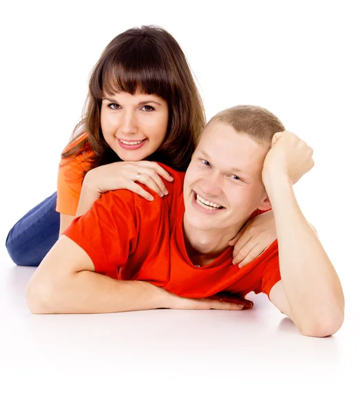 Happy girl lies on the back of a guy — Stock Photo, Image