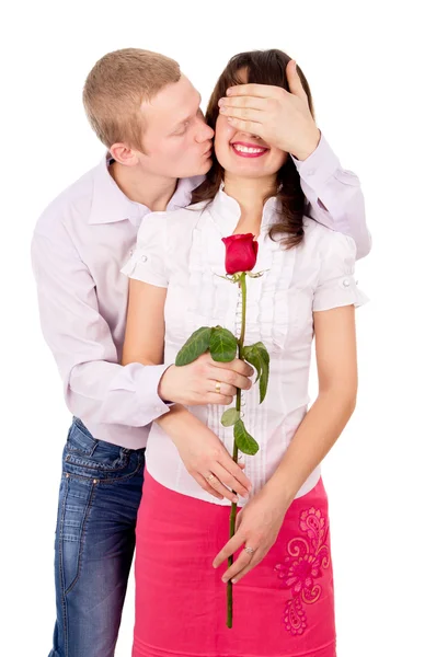 The guy gives a girl a rose, kisses — Stock Photo, Image