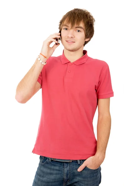 Beautiful guy is standing and talking on a mobile phone — Stock Photo, Image