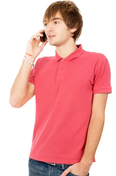 Cheerful guy is standing and talking on a mobile phone — Stock Photo, Image