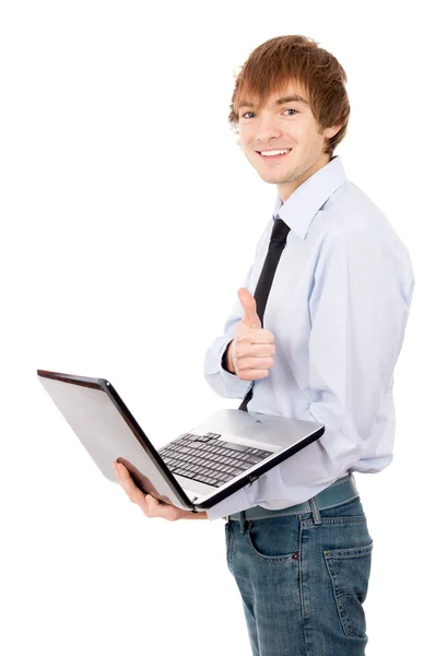 Cheerful guy running on a laptop, dressed in a shirt and tie — Stock Photo, Image