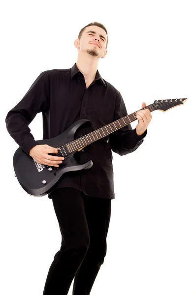 Schöner Kerl spielt E-Gitarre, mit Emotionen — Stockfoto