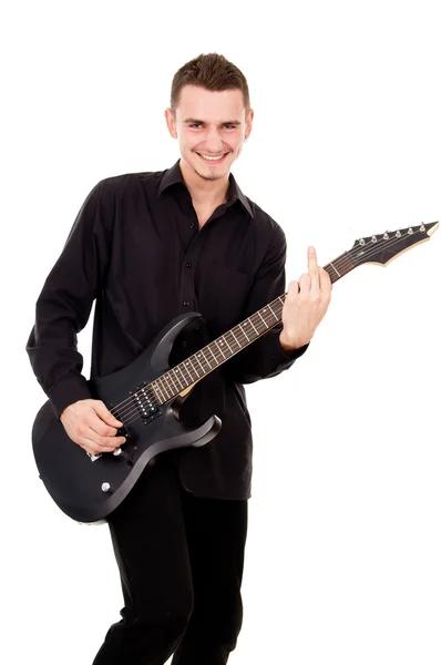 Handsome guy plays the electric guitar — Stock Photo, Image