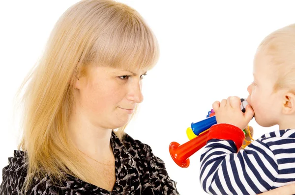 Kid blowing on mother in football beep — Stock Photo, Image