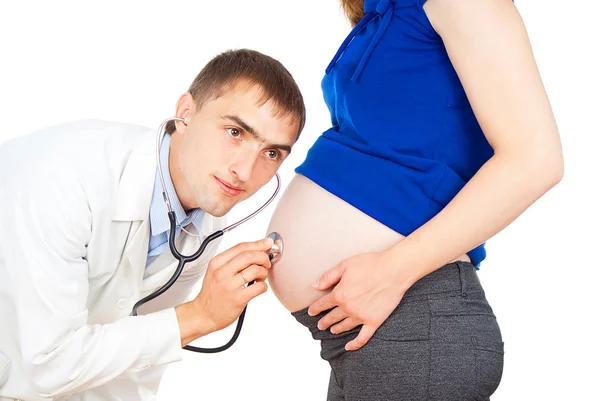 Läkare observerar en gravid Tjej — Stockfoto