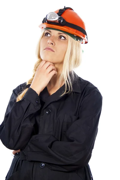 Ragazza in un casco pensando il costruttore — Foto Stock