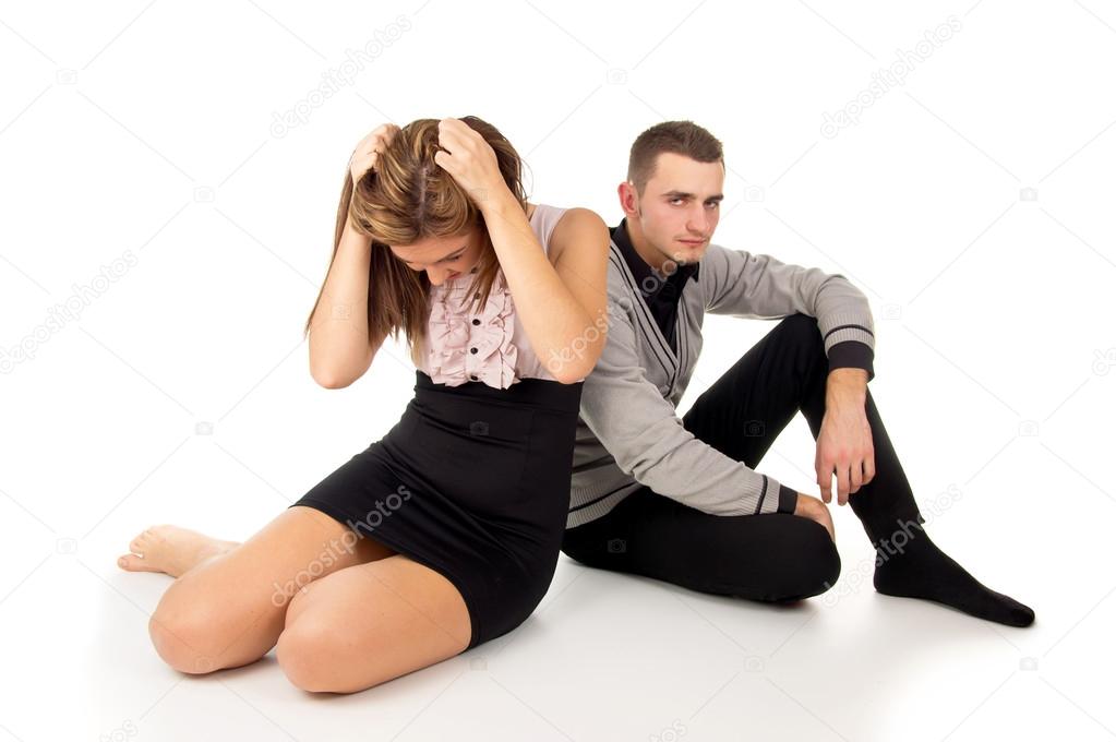 girl and boy sitting upset