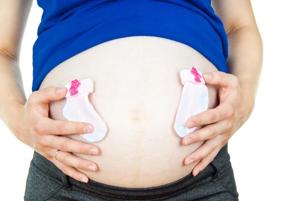 Bauch eines schwangeren Mädchens und Blumen — Stockfoto