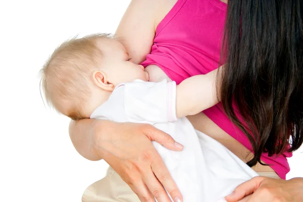 Baby eats milk through the breast — Stock Photo, Image