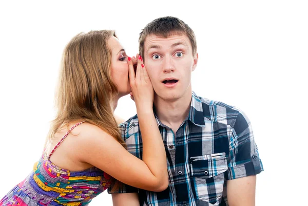 Beautiful girl says a guy whispers in your ear — Stock Photo, Image