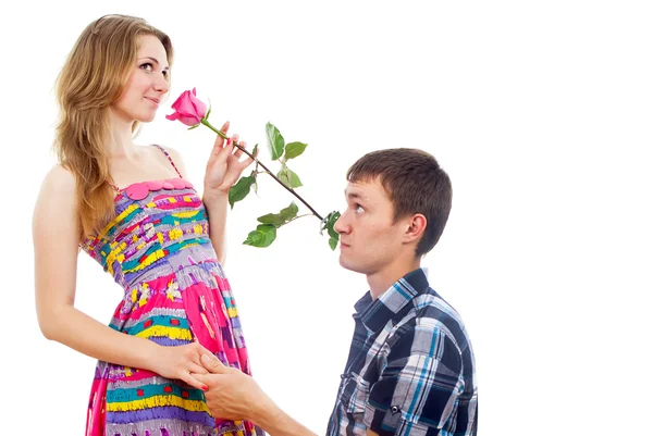 Menina bonita com uma rosa e um cara — Fotografia de Stock