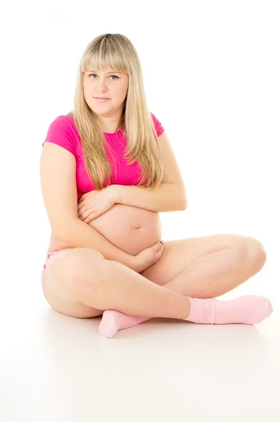 Mooi zwangere meisje in een vest-vergadering — Stockfoto