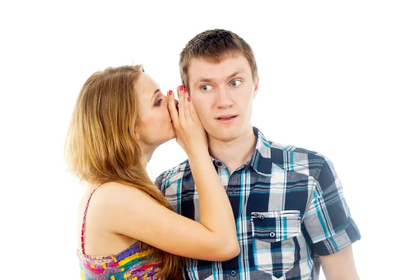 Girl says a guy in the ear — Stock Photo, Image