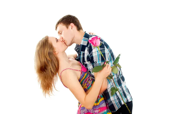 Guy hugs a girl with a rose — Stock Photo, Image