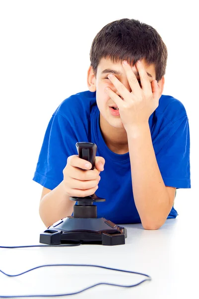 Handsome boy plays on the joystick — Stock Photo, Image