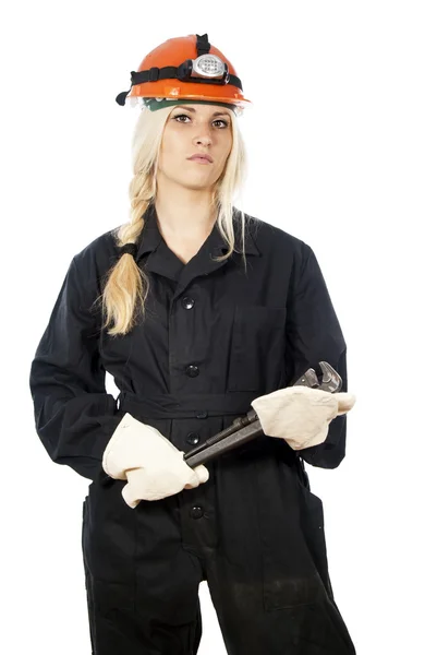 Happy girl to construction a helmet with a key — Stock Photo, Image