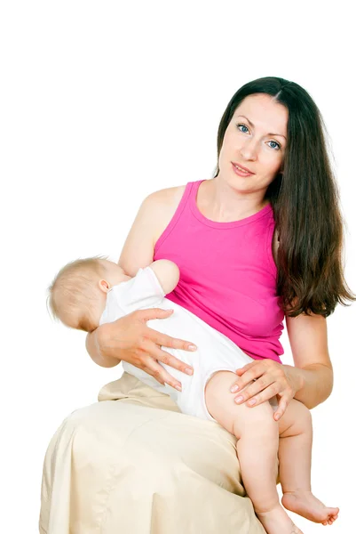 Happy mother feeds baby — Stock Photo, Image