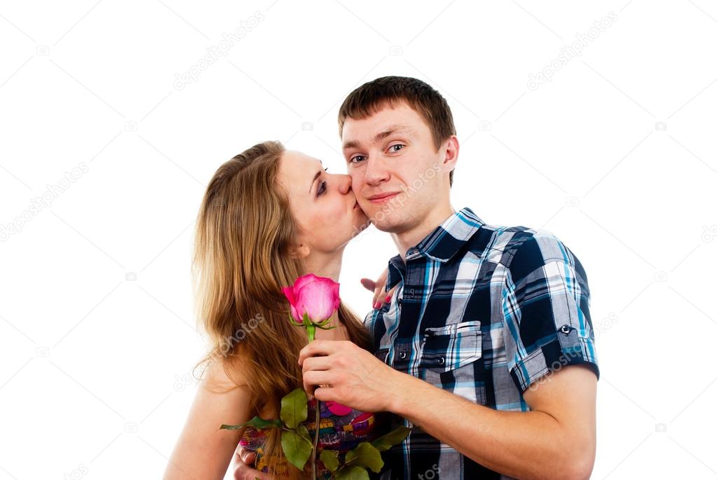 beautiful girl kisses a guy