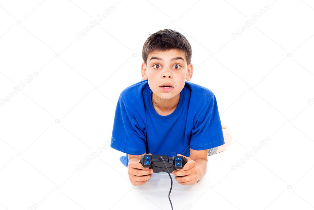 Boy playing computer games on the joystick