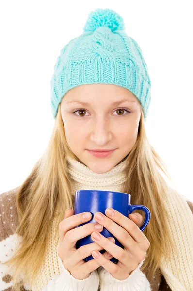 Portrait of a girl in a cap and a mug — Stock Photo, Image