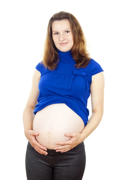 Donna incinta toccando delicatamente lo stomaco al — Foto Stock