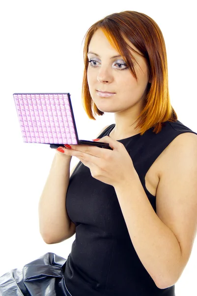 Redhead girl holding a makeup — Stock Photo, Image