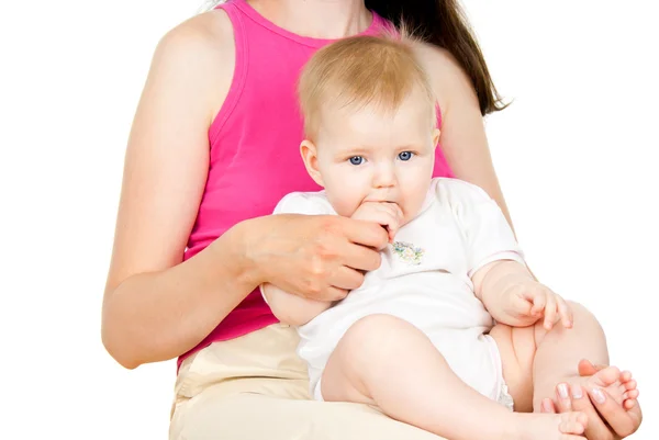 Beautiful babe in the mother sits — Stock Photo, Image