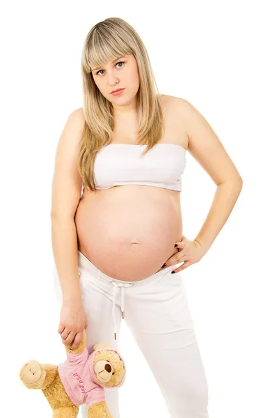 Mooie zwangere meisje met een stuk speelgoed Beer — Stockfoto