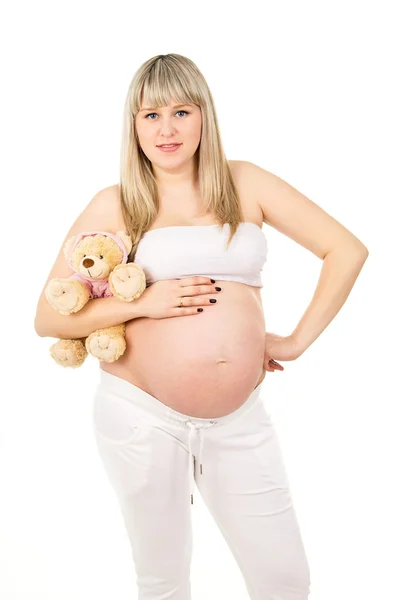 Menina grávida com um brinquedo — Fotografia de Stock