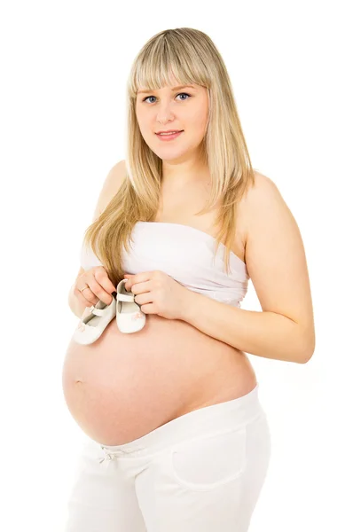 Gravid flicka med skor — Stockfoto