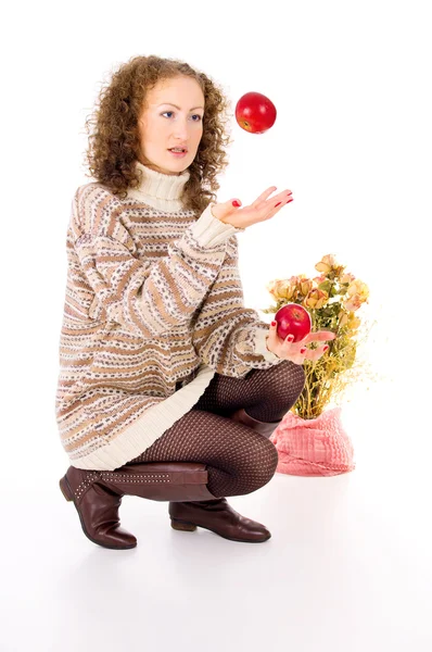 Meisje in een trui en appels Rechtenvrije Stockfoto's