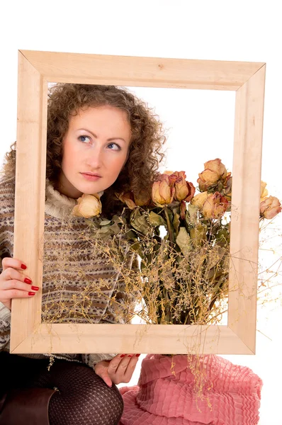 Girl with a frame and still life Stock Photo