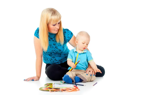 Mother with a child draws Stock Image