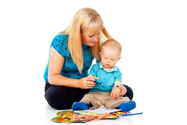 Mother with a child engaged Royalty Free Stock Images