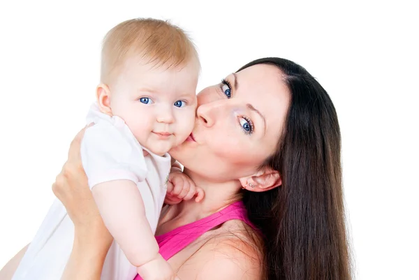 Young mother kissing baby Stock Photo
