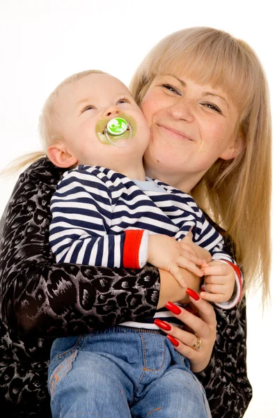 Mother keep merry little baby in her arms, sucking a pacifier — Stock Photo, Image